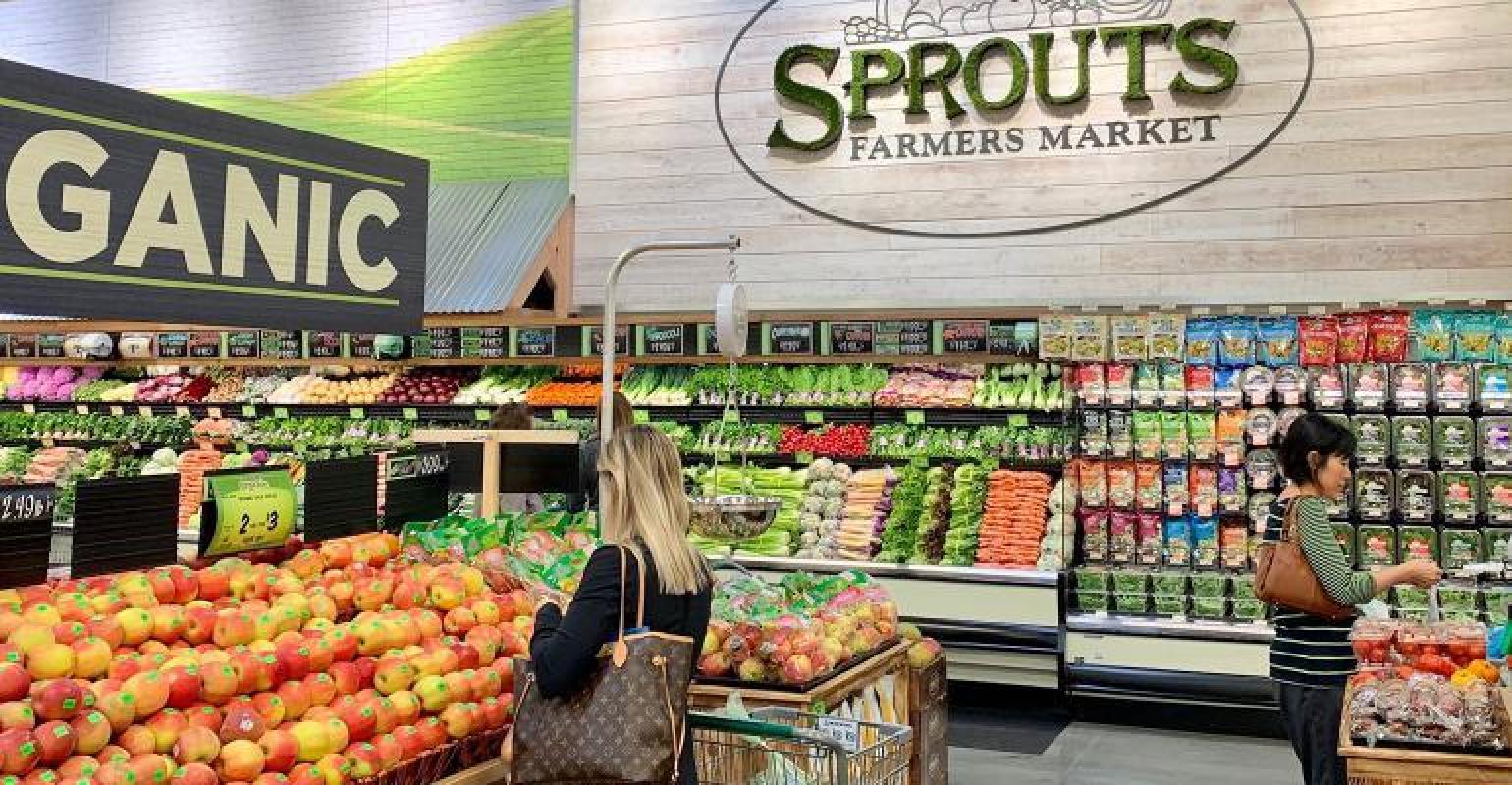 Lady shops in produces section at store